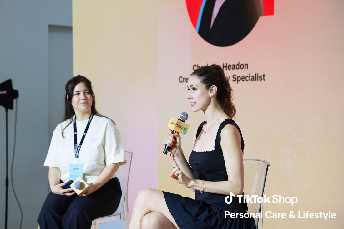 Cassandra Bankson speaking on a stage panel